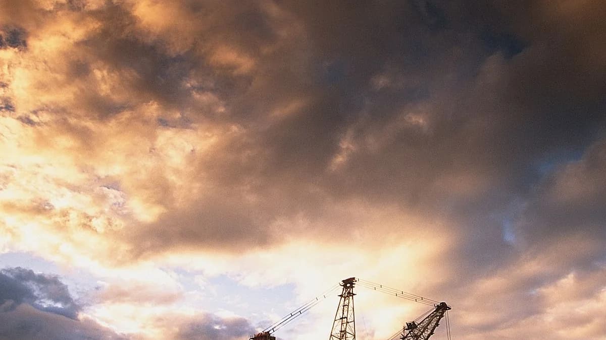 A dragline silhouetted against heavy cloud at an Australian mine